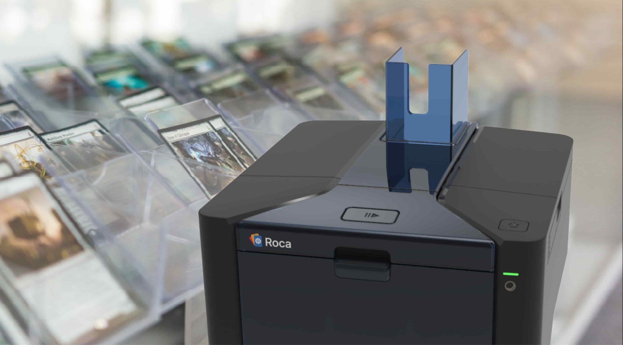 Roca Sifter powered on, with trading cards on the left